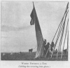 WOMEN PITCHING A TIPI.<br> (Lifting the covering into place.)