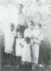 56 (above): The author with a family of Mayan friends—the Het Zooz-Mukuls of Tekom, Yucatan. The mother is holding one of the author's god-children, Manuelita. Note: all are standing on the same level. The author is 6 feet tall. (Author)